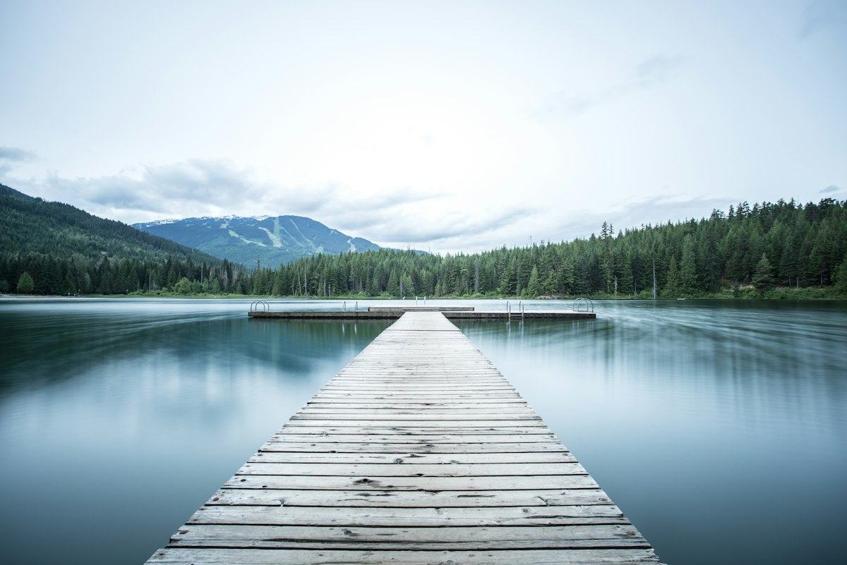 Wooden dock stretching into a calm lake
